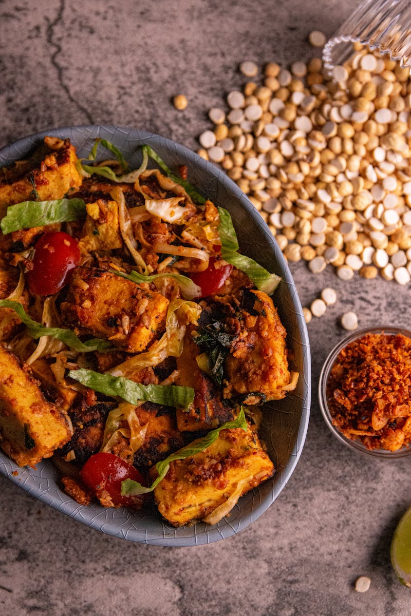 Street food stall in Bangkok with steaming stir-fries